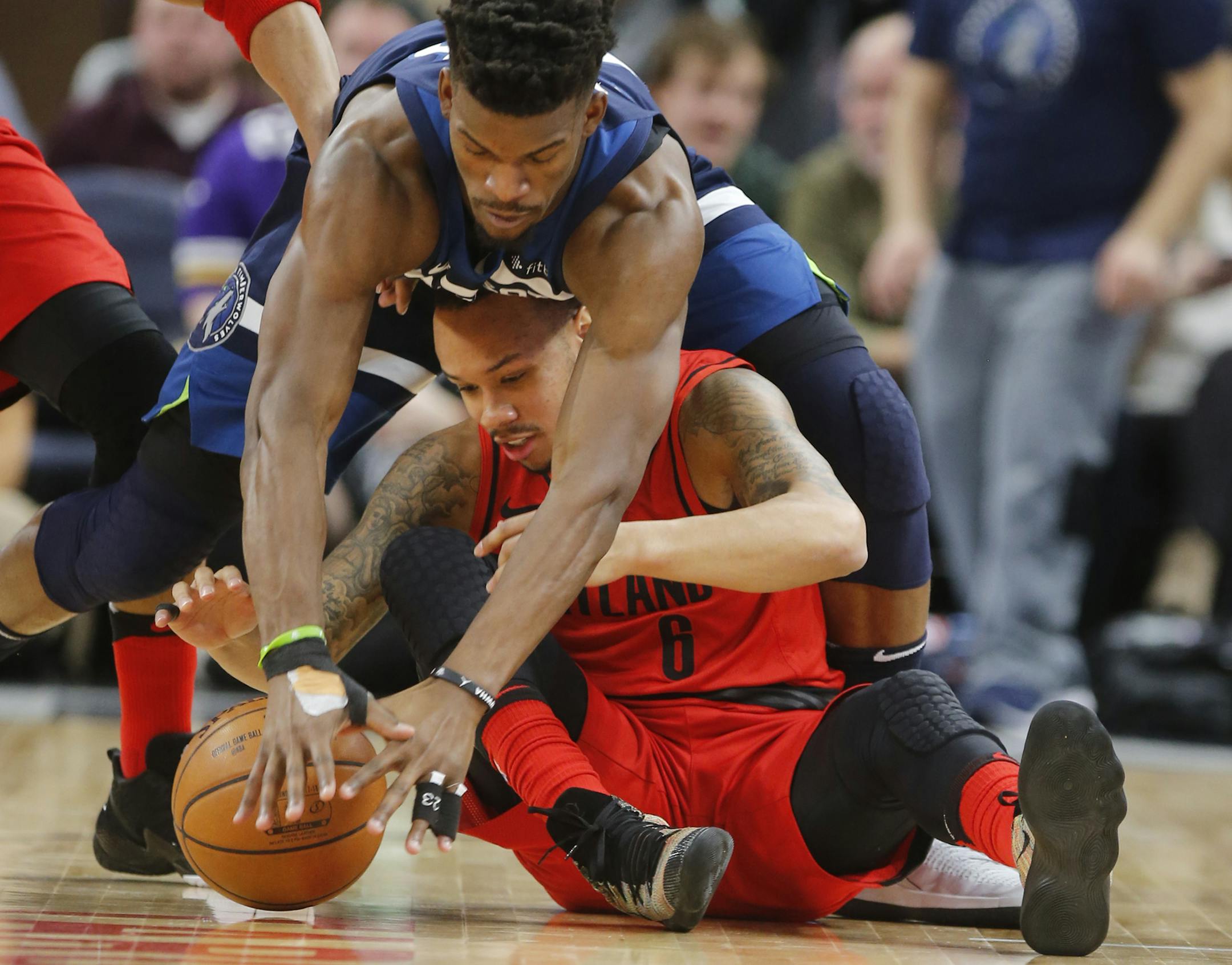 Jimmy Butler(23) goes for a loose ball against Shabazz Napier(6).]The Wolves take on the Blazers at Target Center. Richard Tsong-Taatariiïrtsong-taatarii@startribune.com