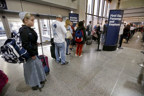 Travelers stood in a TSA screening line at Minneapolis-St. Paul International Airport in November.