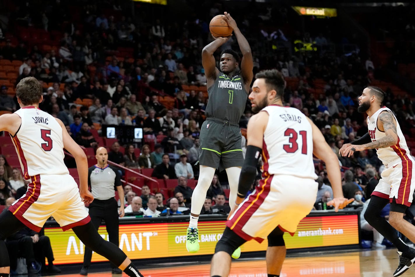 Minnesota Timberwolves guard Anthony Edwards (1) shoots during the first half of an NBA basketball game against the Miami Heat, Monday, Dec. 26, 2022, in Miami. (AP Photo/Lynne Sladky)