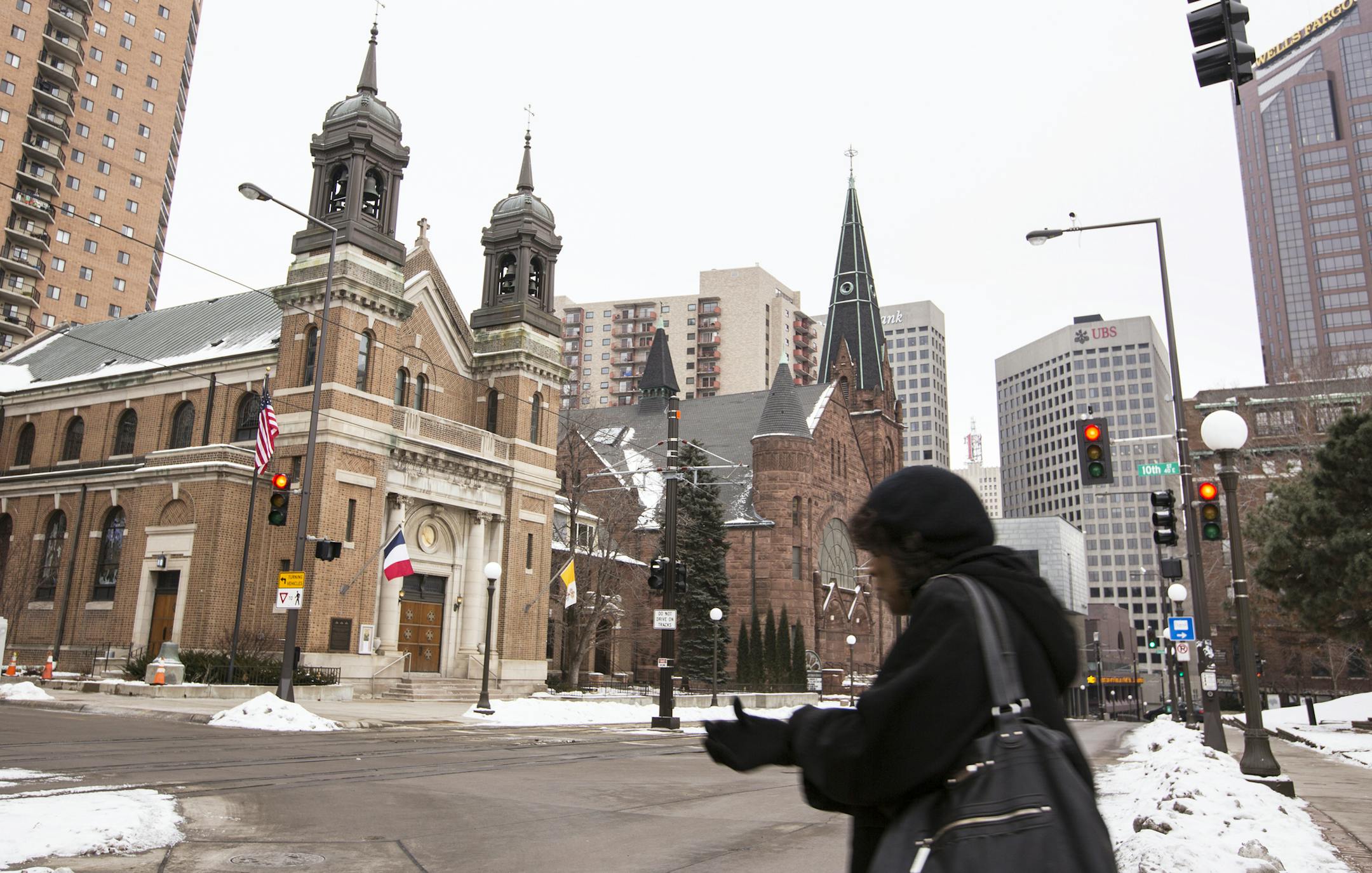 The Church of St. Louis, King of France, left, and Central Presbyterian Church are neighbors in downtown St. Paul.