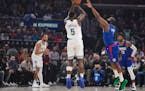Timberwolves guard Anthony Edwards (5) shoots over Clippers guard James Harden during the first half Tuesday in Los Angeles.