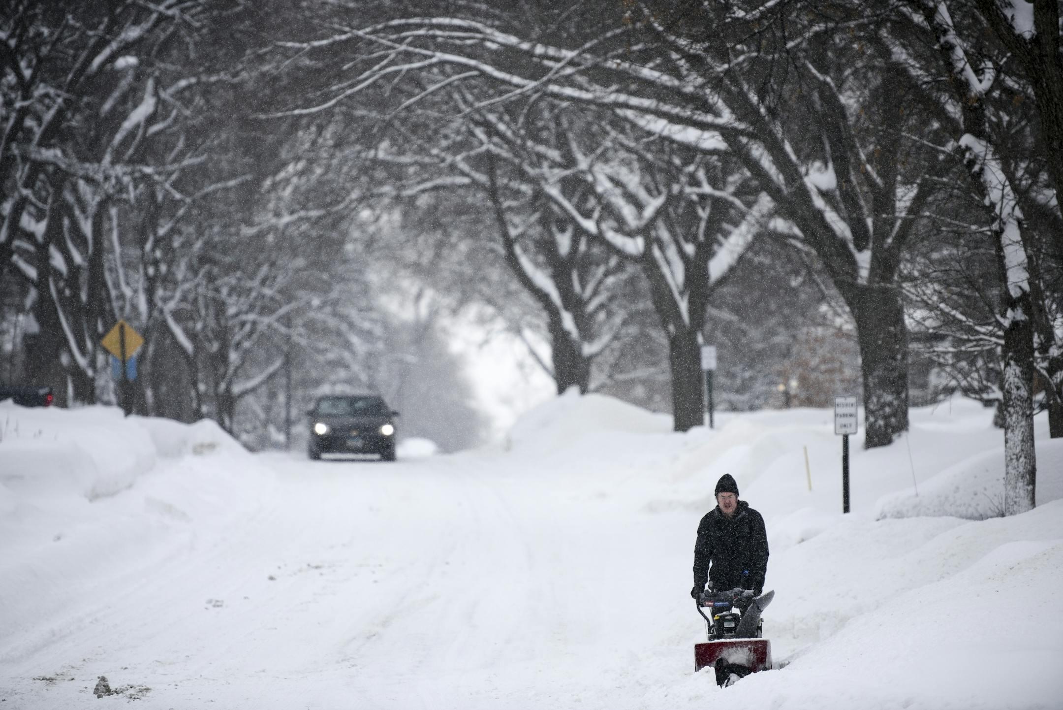 Joseph Poppy, of Robbinsdale, used a snowblower to remove snow from the front of his home at Lowery and France Avenue North. "I didn't go to work," Poppy said.