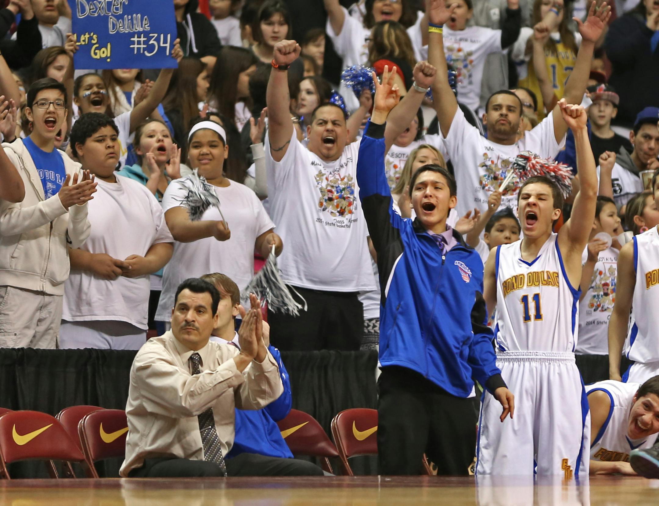 (left to right) Fond du Lac Ojibwe fans cheered on their team against Canby.] Boys Basketball Tournament, Fond du Lac Ojibwe vs. Canby, Class 1A game at Williams Arena, 3/13/14. Bruce Bisping/Star Tribune bbisping@startribune.com