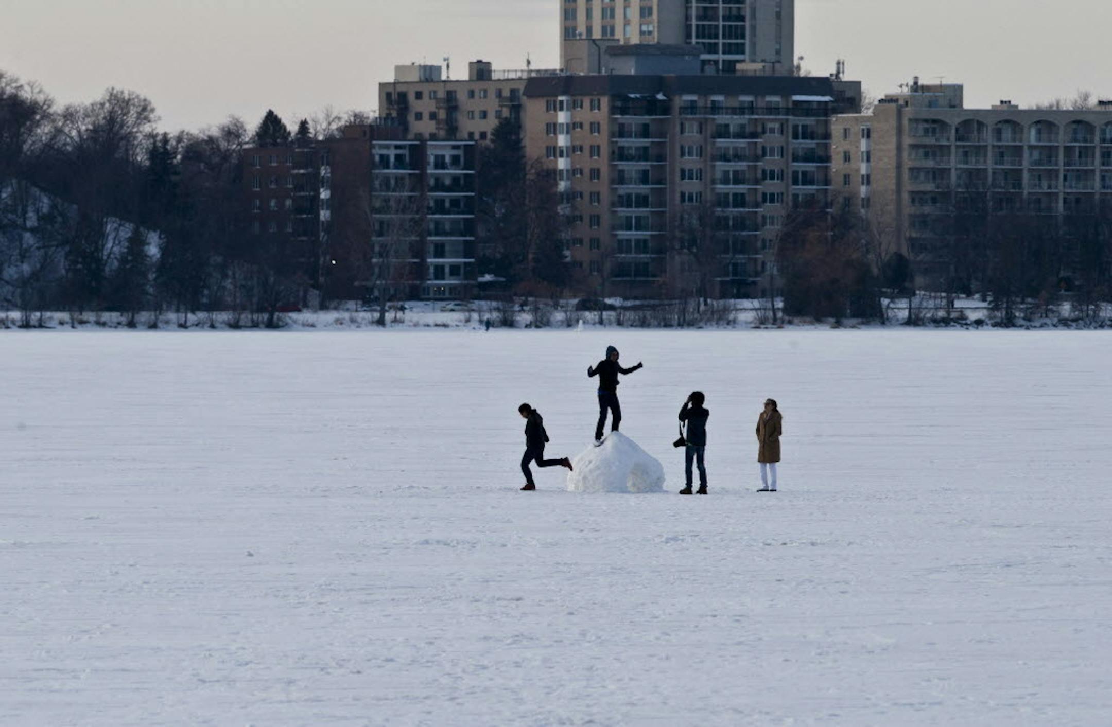 Jan. 14, 2013: A group of friends and family from Roseville enjoyed climbing on a snow fort while taking pictures on the frozen surface of Lake Calhoun in Minneapolis, Minn.