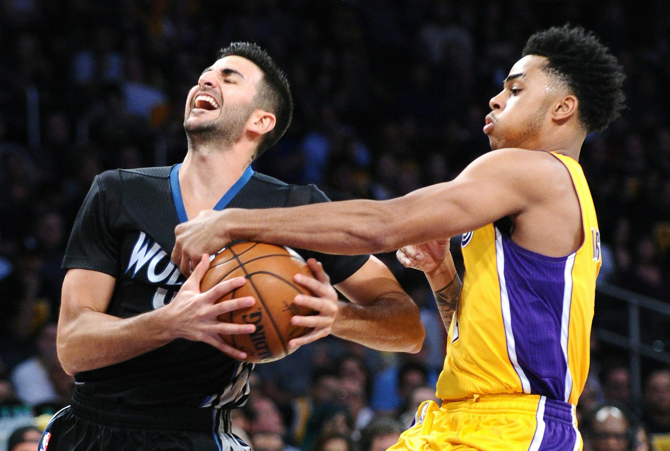 The Los Angeles Lakers' D'Angelo Russell, right, fouls the Minnesota Timberwolves' Ricky Rubio in the first quarter at Staples Center in Los Angeles on Wednesday, Oct. 28, 2015.