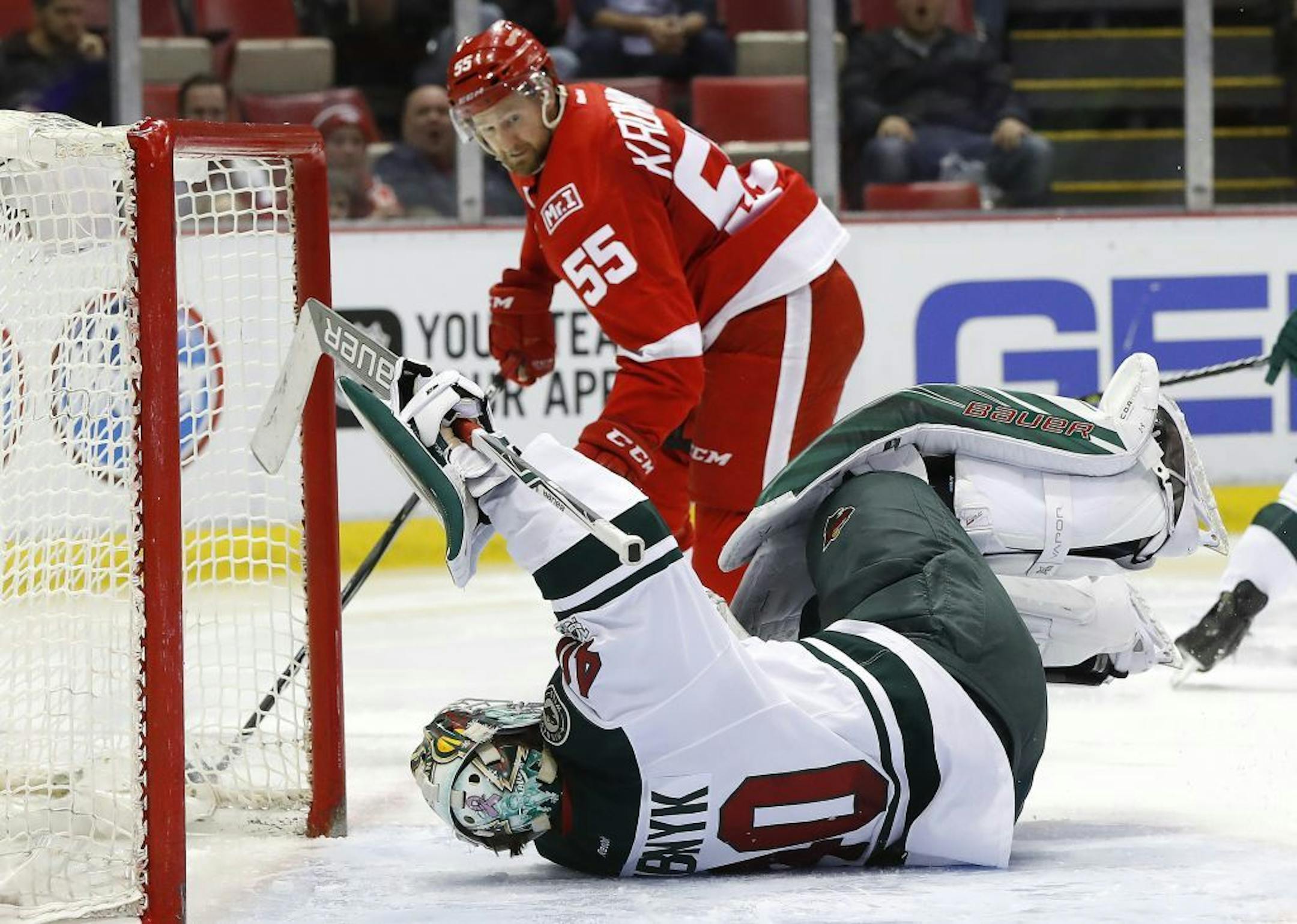 Wild goalie Devan Dubnyk fell after being hit by Red Wings defenseman Niklas Kronwall in the second period Sunday in Detroit.