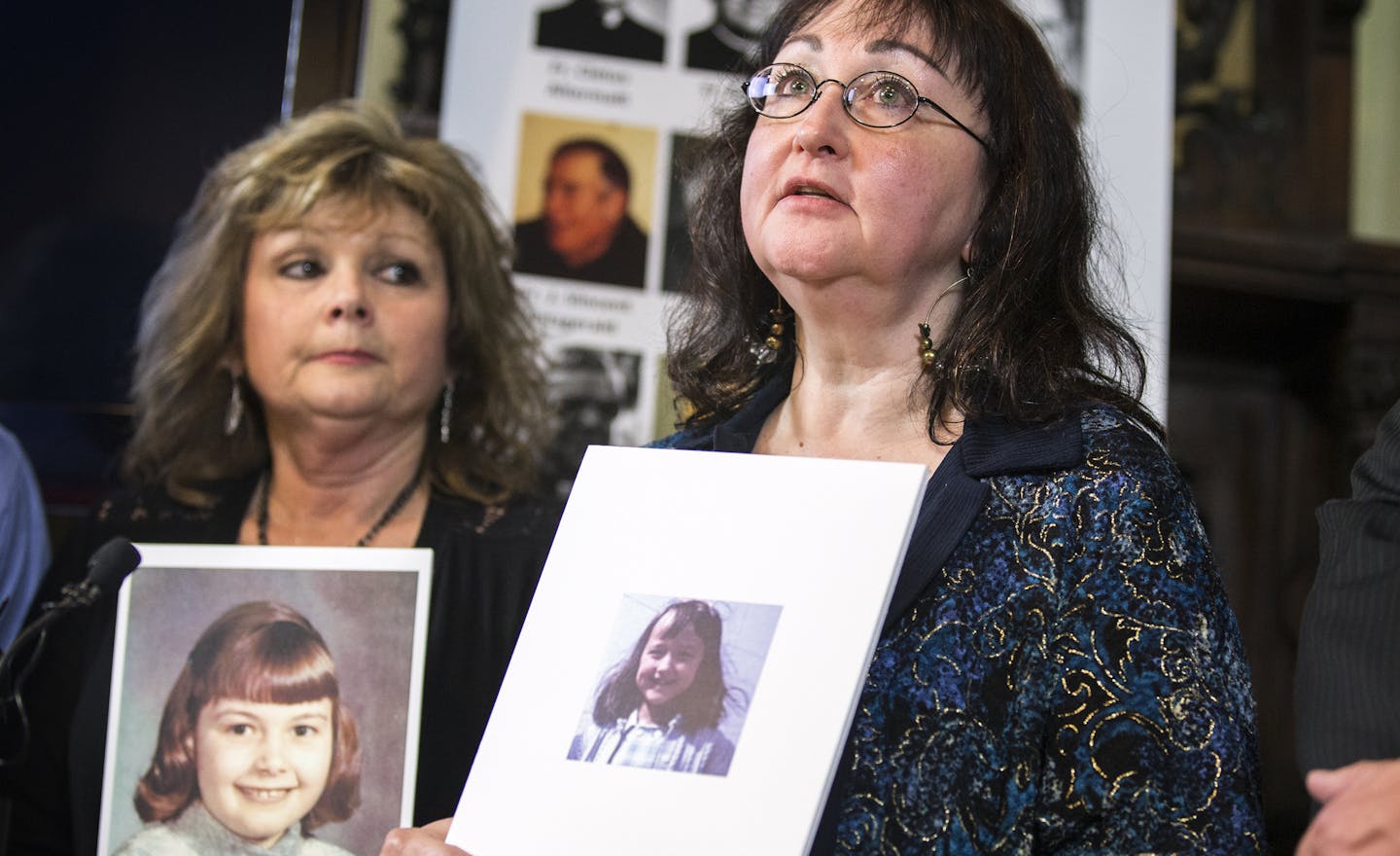 Lori Stoltz, one of the victims of deceased Diocese of New Ulm priest Fr. David Roney, holds a photo of herself at the age when she was abused as she speaks during a press conference at Jeff Anderson & Associates law office in St. Paul. ] (Leila Navidi/Star Tribune) leila.navidi@startribune.com BACKGROUND INFORMATION: Tuesday, March 29, 2016 in St. Paul. The Diocese of New Ulm released the names of 16 priests credibly accused of sexually abusing children following more than two years of demands