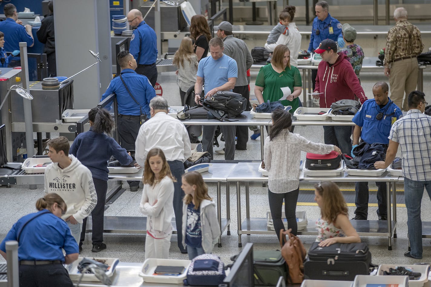 Travelers made their way through the TSA security at Terminal 1 at the Minneapolis/St. Paul International Airport, Thursday, May 23, 2019 in Bloomington, MN. Nearly 43 million Americans will take to the streets, rails and skies this summer beginning Memorial Day. The surge in expected travel comes despite gas prices increasing by more than 30 cents over the past two months nationally. Consumer spending remains strong, AAA says. ] ELIZABETH FLORES &#x2022; liz.flores@startribune.com