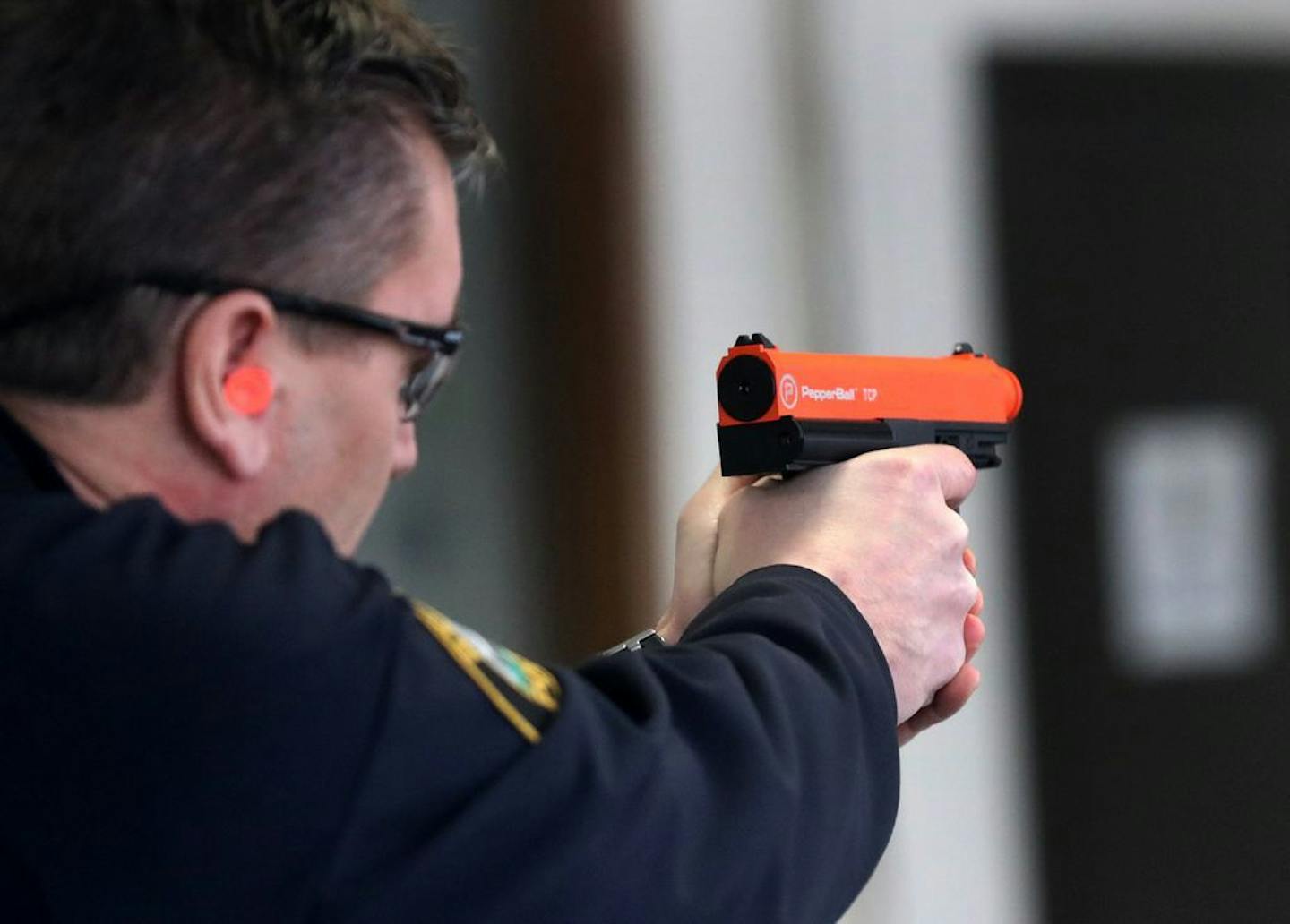 St. Paul Police Commander Kurt Hallstrom with a PepperBall launcher at a downtown St. Paul Police Department training site Wednesday, Feb. 6, 209, in St. Paul, MN.