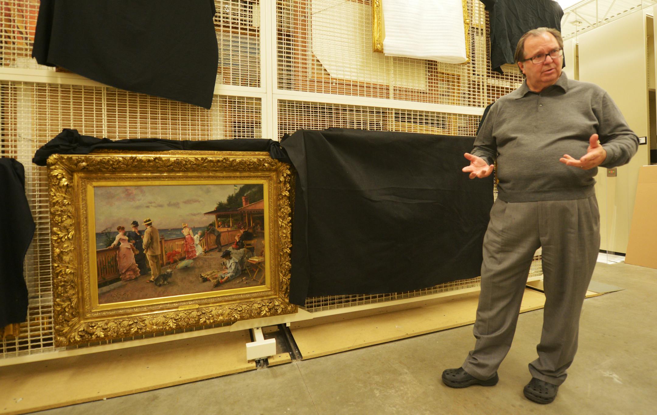 John Driscoll, from New York, talked about the new paintings at the Minnesota Marine Art Museum. At lower left is a 1884 Alfred Stevens painting. DAVID
BREWSTER
Star Tribune