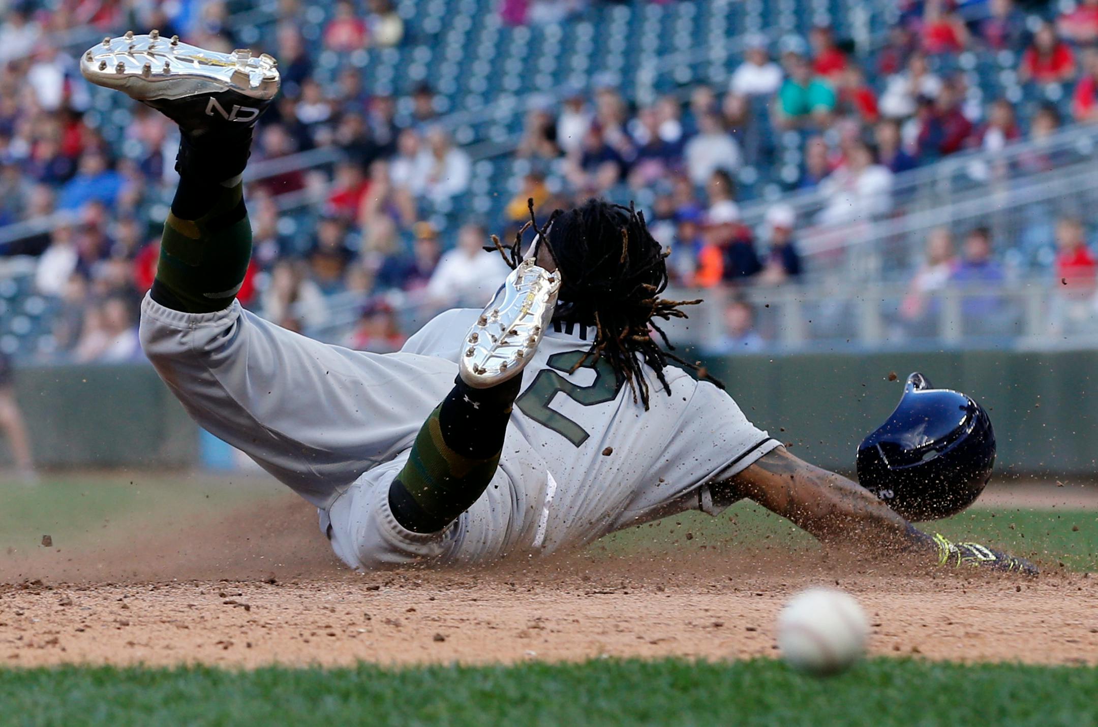Tampa Bay Rays' Michael Martinez slides safely uncontested on a double by Corey Dickerson off Minnesota Twins relief pitcher Justin Haley in the 14th inning of a baseball game Sunday, May 28, 2017 in Minneapolis. The Rays won 8-6 in 15 innings. (AP Photo/Jim Mone)