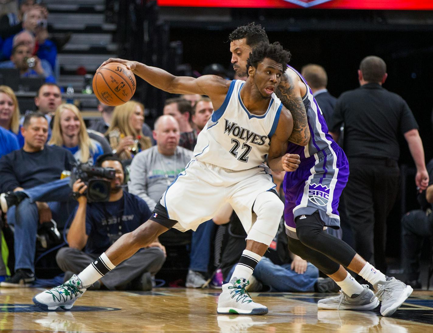 Minnesota Timberwolves forward Andrew Wiggins (22) drives against Sacramento Kings forward Matt Barnes (22) during the second half of an NBA basketball game, Friday, Dec. 23, 2016, in Minneapolis. The Kings won 109-105. (AP Photo/Paul Battaglia)