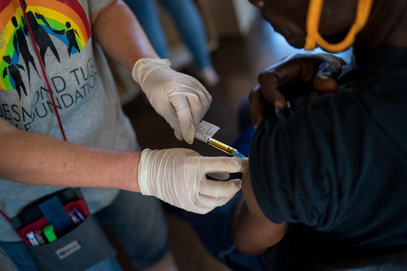 FILE Ñ A nurse carries out trials of a COVID-19 vaccine at the Desmond Tutu HIV Foundation Youth Center in Masiphumelele, South Africa, Dec. 4, 2020. Moderna, whose coronavirus vaccine was developed with the financial and scientific support of the U.S. government, has been supplying its shots almost exclusively to wealthy nations, keeping poorer countries waiting and earning billions in profit. (Joao Silva/The New York Times)