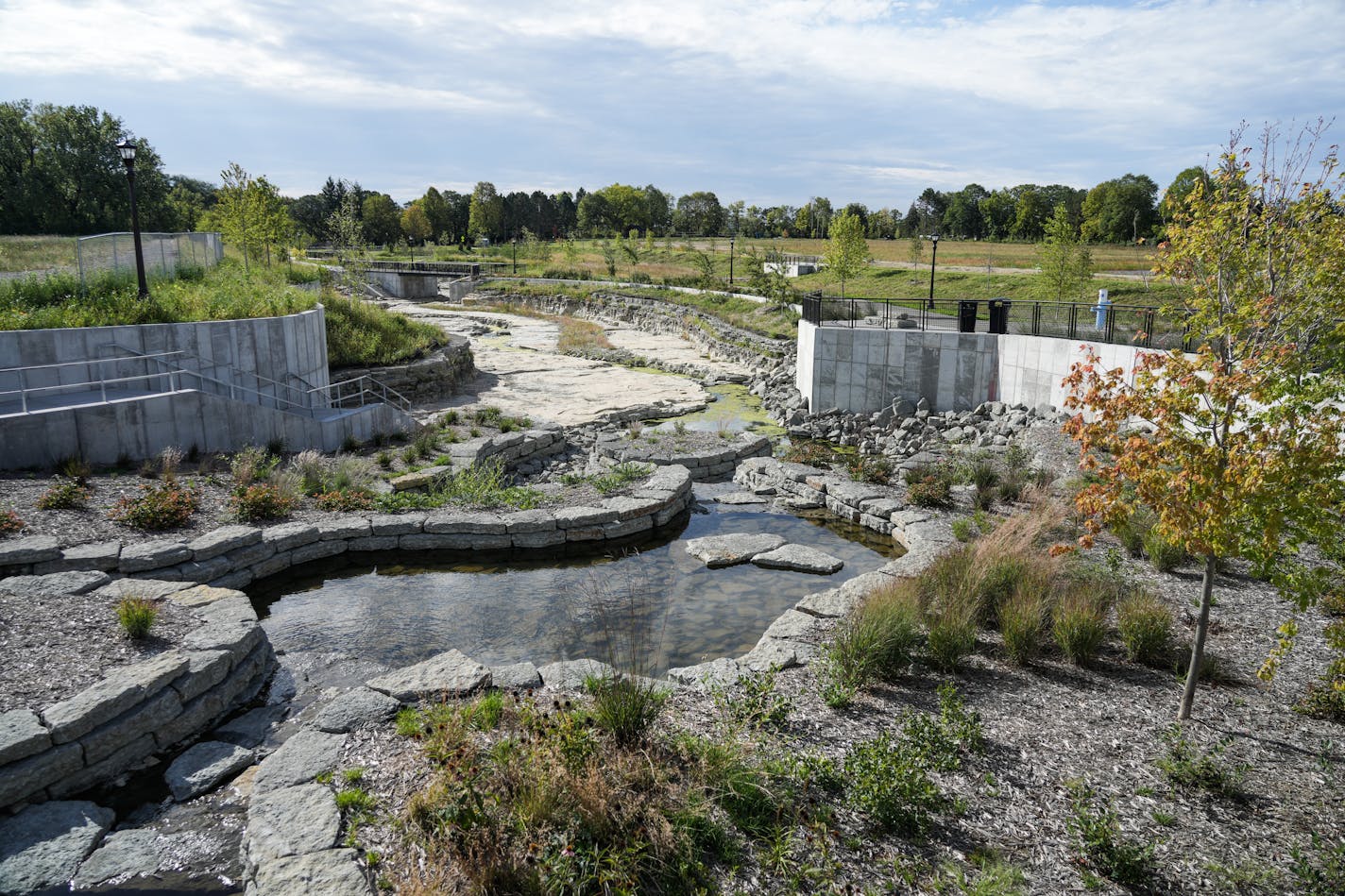 Once buried beneath the former Ford site, a reconstructed Hidden Falls Creek is a centerpiece of the new Highland Bridge development. The water feature is designed to allow residents to interact with the creek while also filtering stormwater runoff. Photographed Wednesday, Sept. 21, 2022 in St. Paul. ] MARK VANCLEAVE • mark.vancleave@startribune.com ORG XMIT: DSC05540_edt