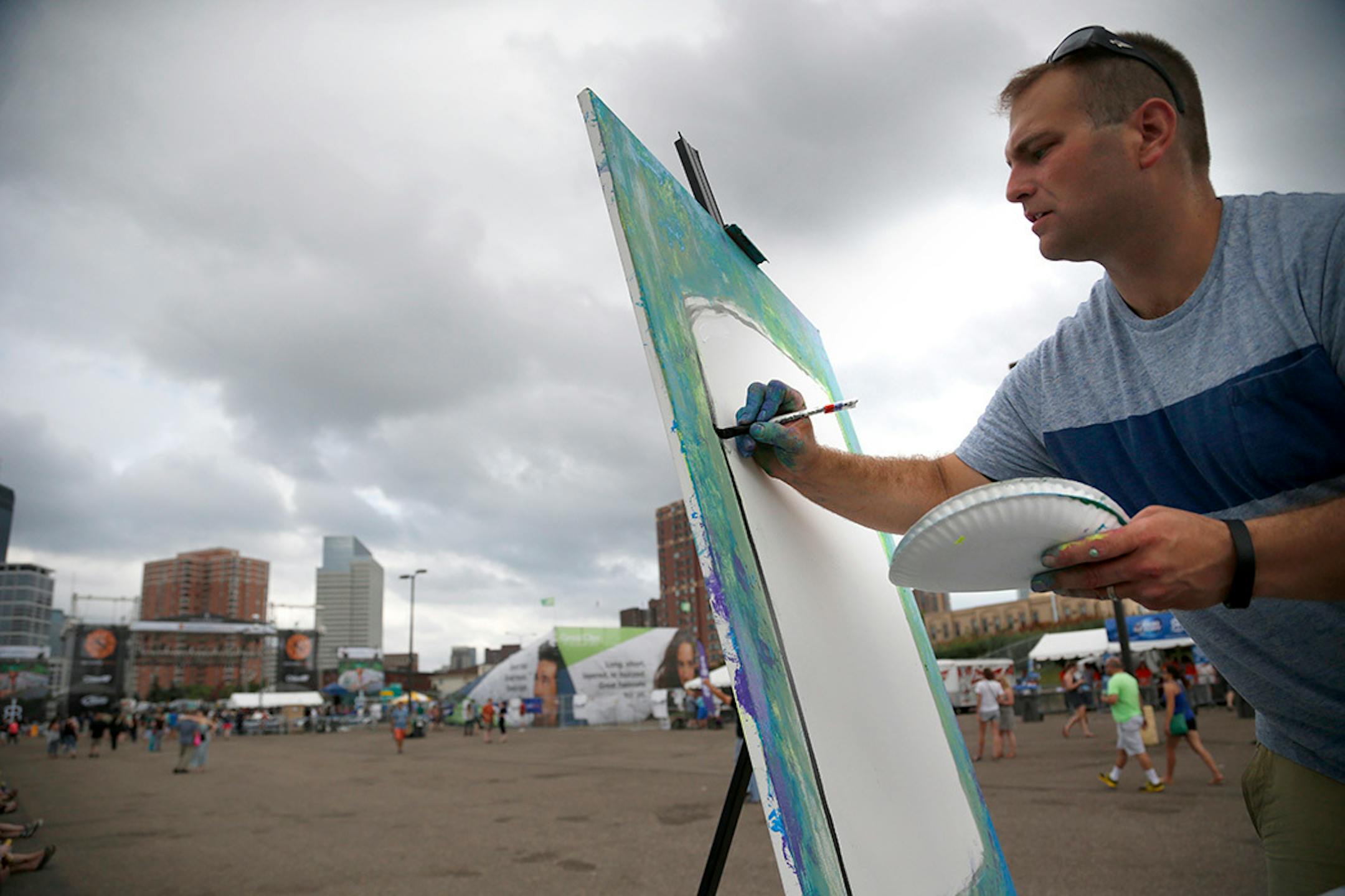 Nick Reitenour just started working on his block party art in the Sun Country stage at the Basilica Block Party.