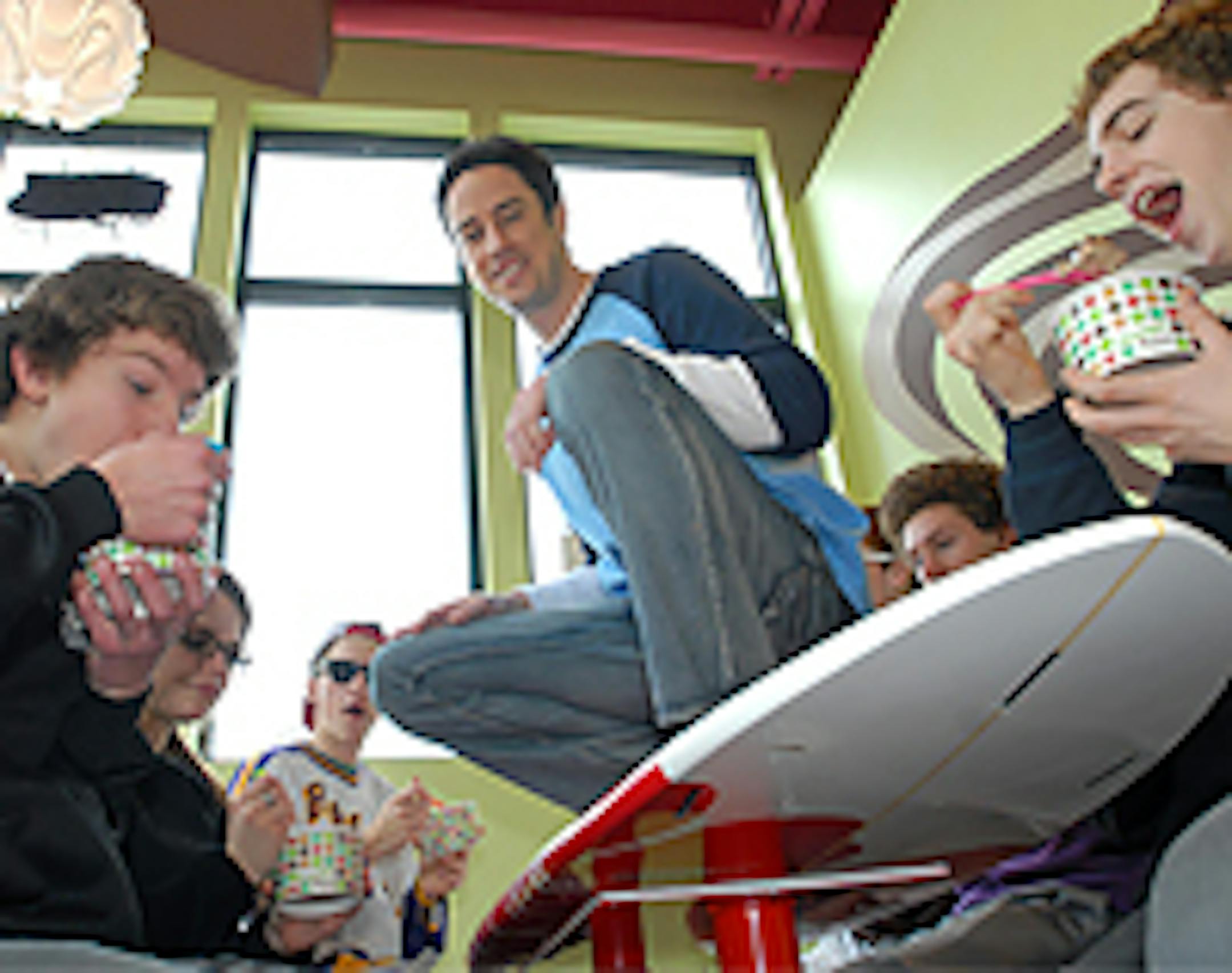 David Brandner (center) and fro-yo fans at FreeStyle Yogurt