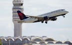 FILE - In this July 28, 2014 file photo, a Delta Air Lines jet takes off from Ronald Reagan Washington National Airport in Arlington, Va. Most restric