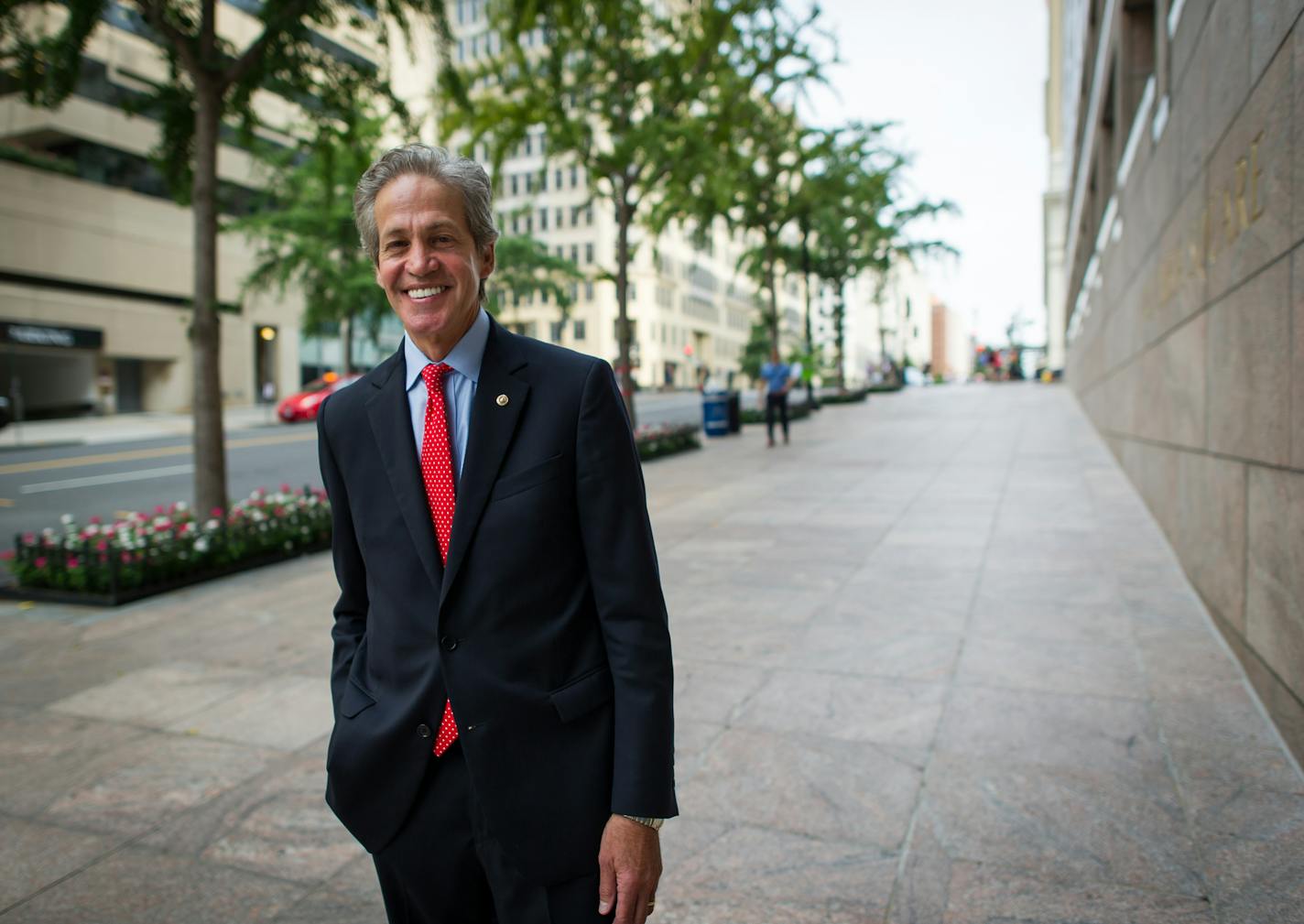 Norm Coleman outside his Washington, D.C. office in 2015. Coleman announced Tuesday that he will undergo surgery later this month to remove part of his lungs after cancer re-emerged there.