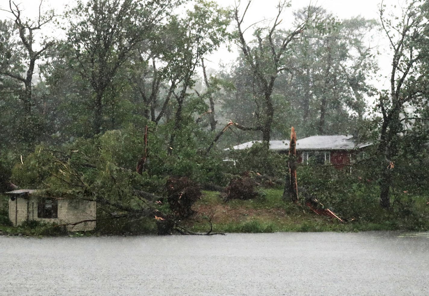 Trees and buildings were damaged Friday in Turtle Lake, Wis., after a strong afternoon thunderstorm moved through.