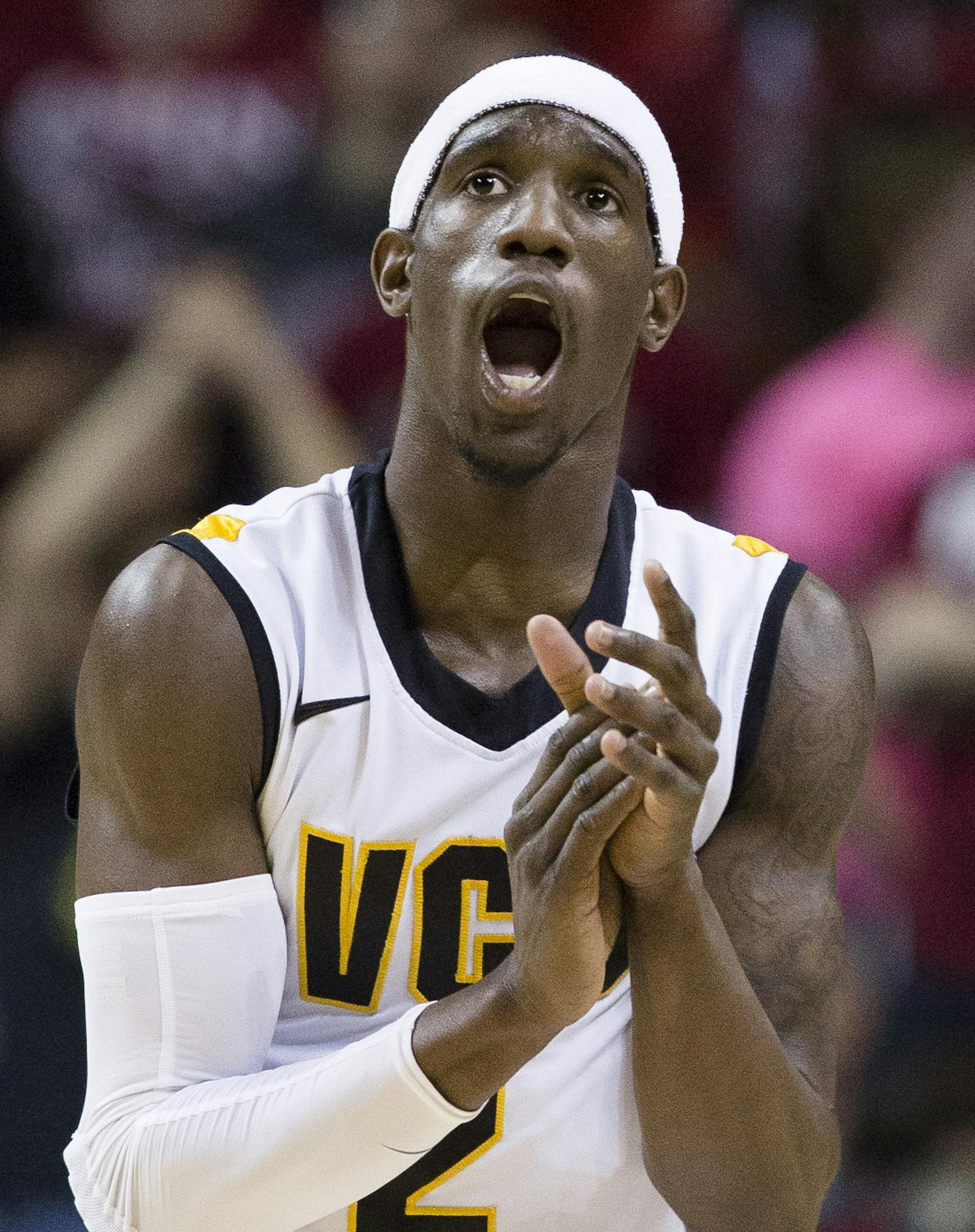 VCU's Briante Weber (2) reacts after scoring against Saint Joseph's during the first half of an NCAA college basketball game at the Atlantic 10 Conference tournament, Friday, March 15, 2013, in New York. (AP Photo/John Minchillo)