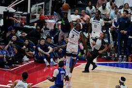 Jaden McDaniels of Minnesota Timberwolves dunks during a preseason NBA basketball game between the Dallas Mavericks and Minnesota Timberwolves in Abu 