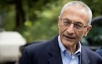 FILE - In this Oct. 5, 2016 file photo, Hillary Clinton's campaign manager John Podesta speaks to members of the media outside Clinton's home in Washi