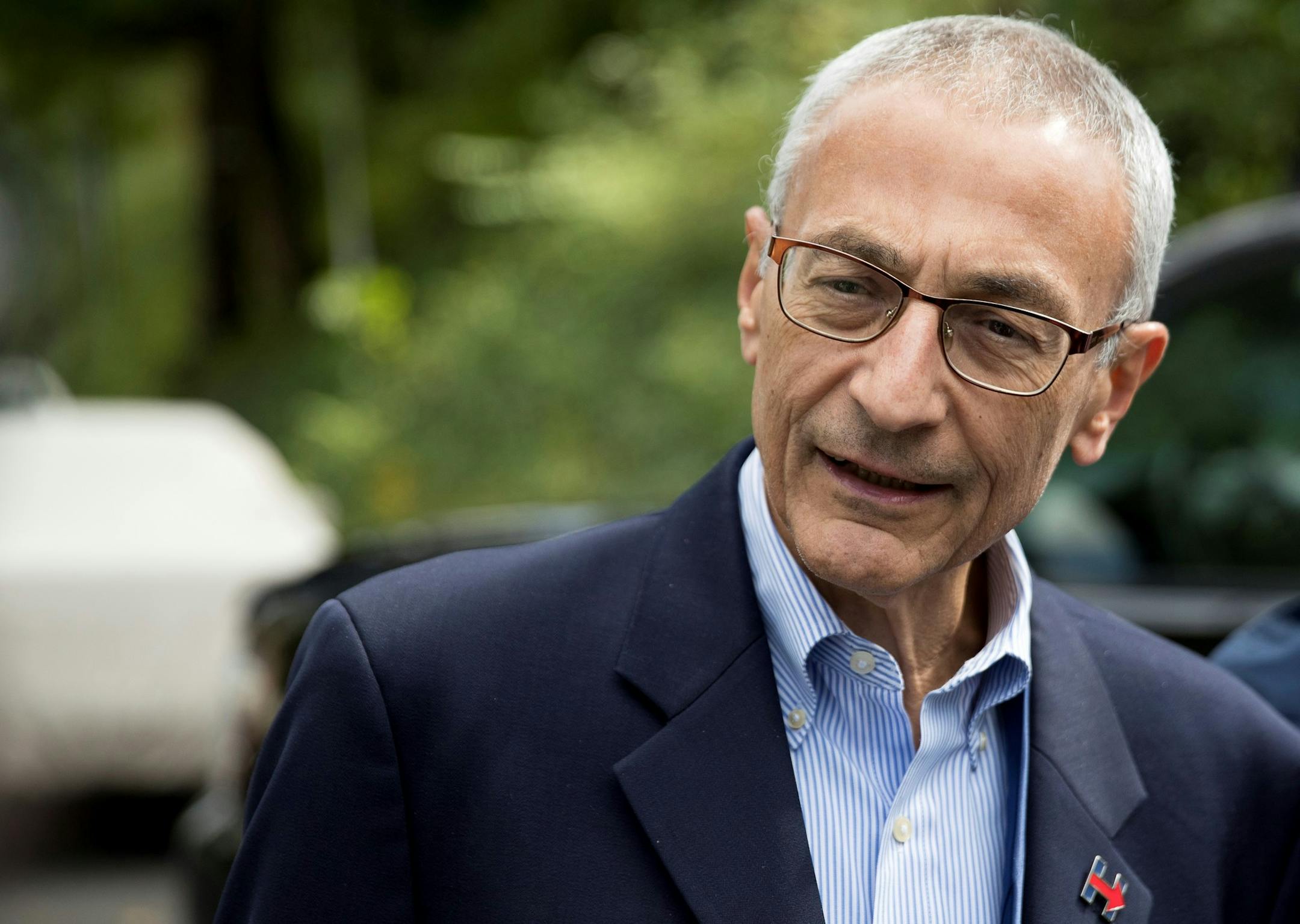 FILE - In this Oct. 5, 2016 file photo, Hillary Clinton's campaign manager John Podesta speaks to members of the media outside Clinton's home in Washington. New evidence appears to show how hackers earlier this year stole more than 50,000 emails of Hillary Clinton&#xed;s campaign chairman, an audacious electronic attack blamed on Russia&#xed;s government and one has resulted in embarrassing political disclosures about Democrats in the final weeks before the U.S. presidential election. (AP Photo/