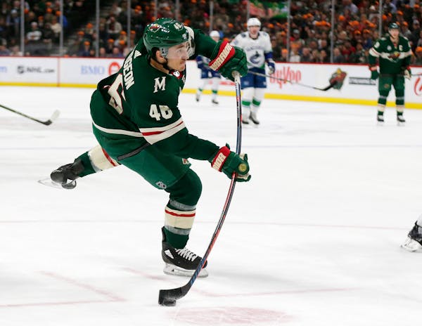 Wild defenseman Jared Spurgeon shoots against the Canucks during the first period Thursday.