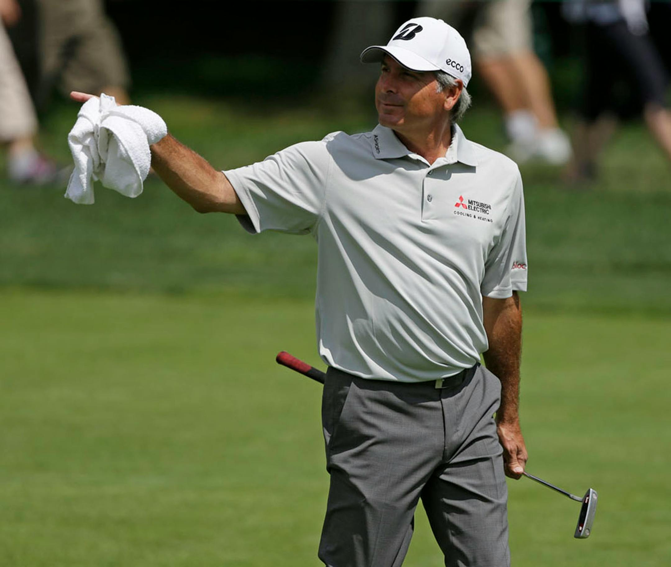 Fred Couples walks to the first green during the final round of the Memorial golf tournament on Sunday, June 2, 2013, in Dublin, Ohio. (AP Photo/Darron Cummings)