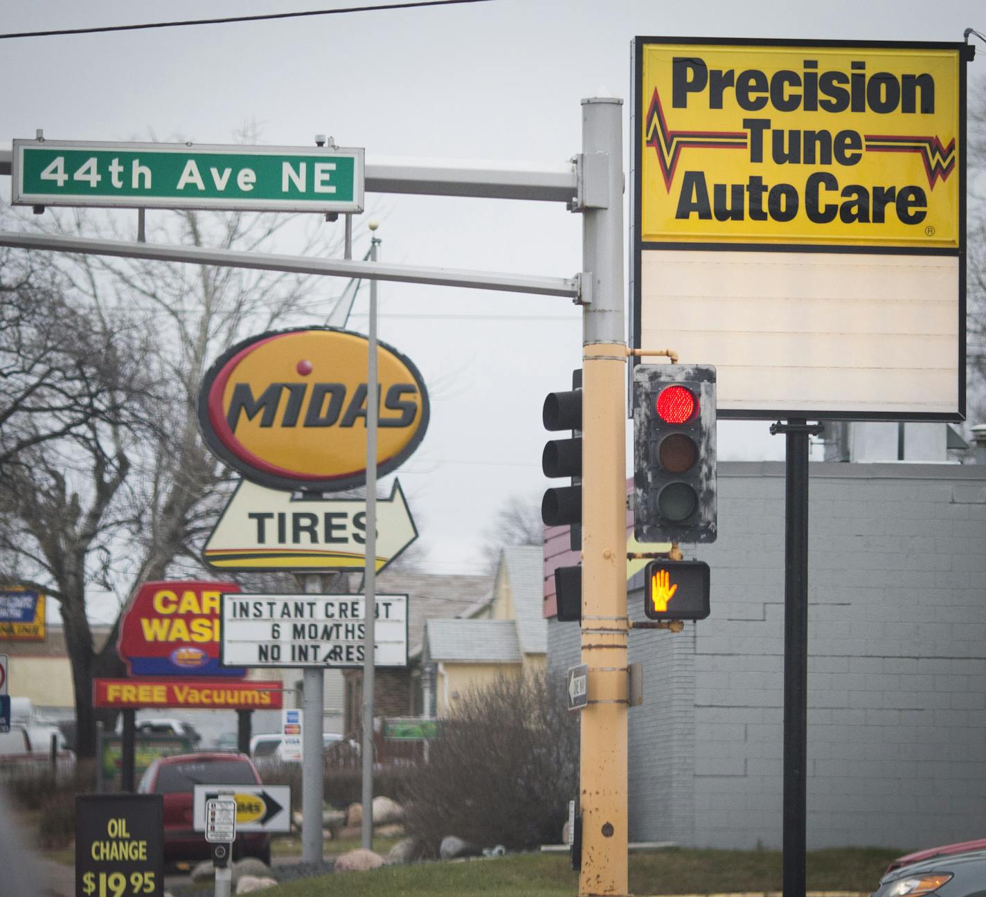 A cluster of auto-related businesses line busy Central Avenue in Columbia Heights.