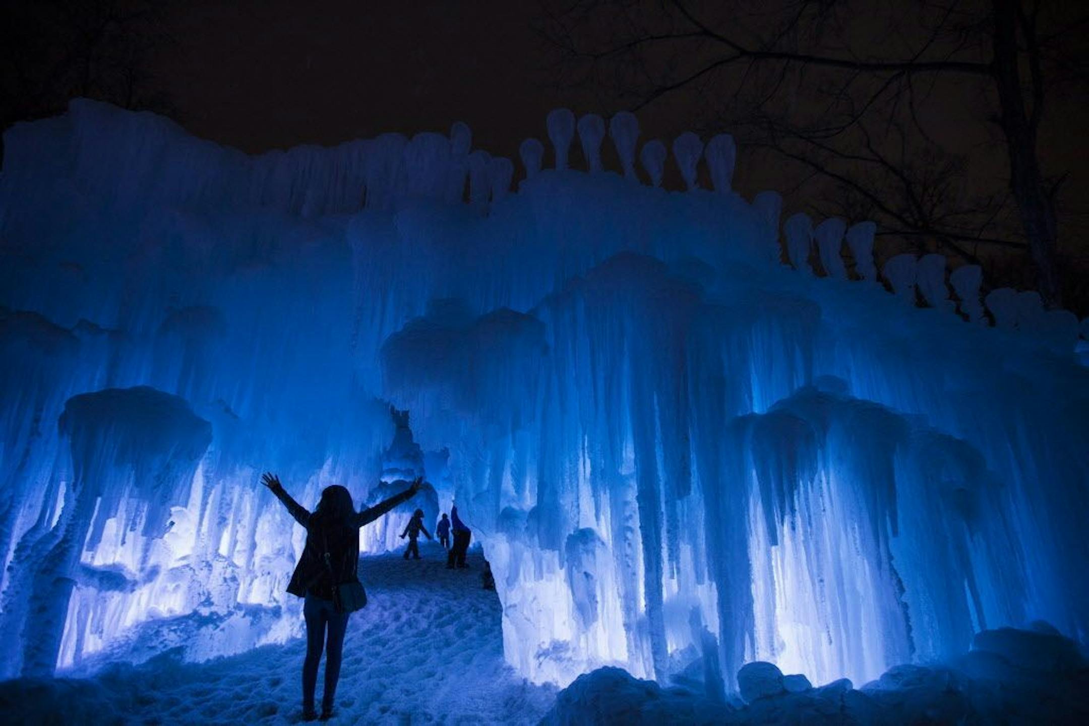 A visiter poses for a photo at the Ice Castles at Miller Park in Eden Prairie on Monday, January 25, 2016.