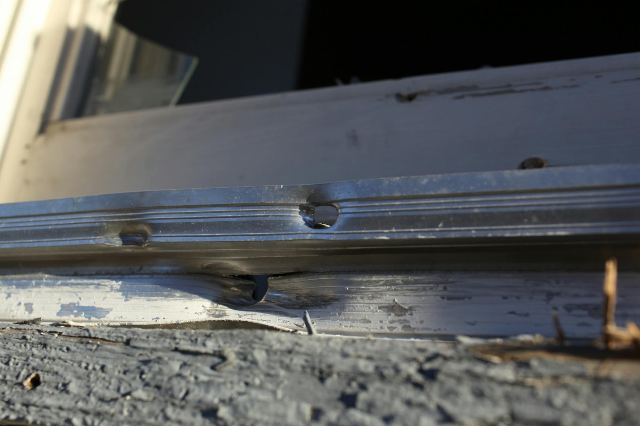 Bullet holes are visible in the window frame of the home at 1527 Queen Ave. North Thursday morning. Wednesday evening someone fired at least 11 shots into the home through a first floor window, wounding two men, a woman and a child who were taken to nearby North Memorial Medical Center and were expected to survive.