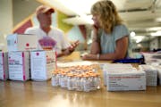Volunteers put together naloxone kits at the headquarters for the nonprofit Steve Rummler HOPE Network.