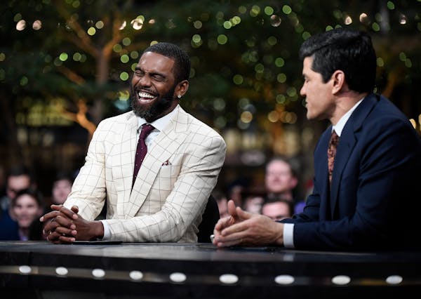 Former NFL wide receiver Randy Moss joked with former linebacker Tedy Bruschi Thursday during an appearance on Sports Center in the IDS Center. ] AARO