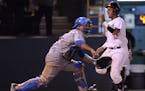 Maryland's Kevin Martir scored past UCLA's Darrell Miller Jr. during the fourth inning on Monday night's regional final in Los Angeles. The Terrapins 