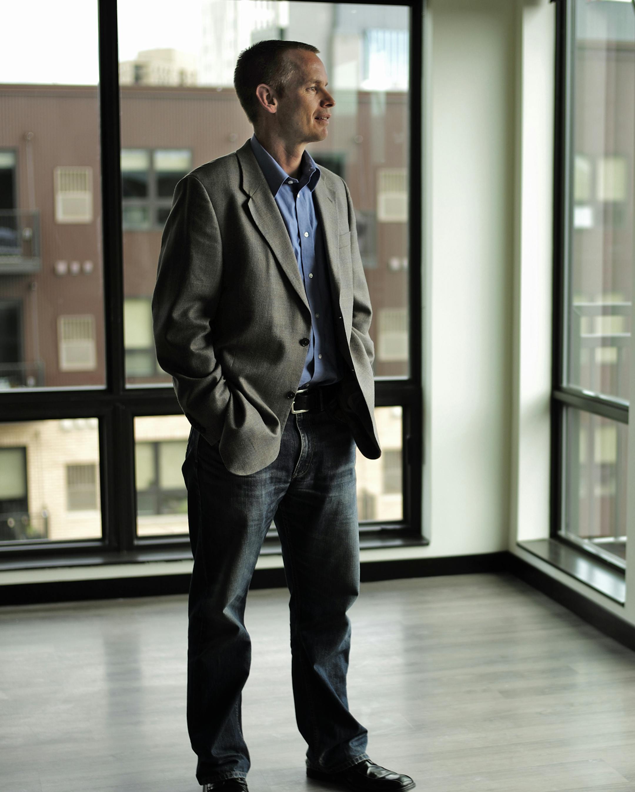 On July 15, 2014, at the Velo apartment complex nearing completion, Opus Director Project ManagemerTom Becker is saving his company tons of time and money by building big chunks of their buildings (such as huge exterior wall panels) at off-site factories, trucking them in and craning them into place rather than doing it all on-site. The apartments across the street were also built similarly.]rtsong-taatarii@startribune.com