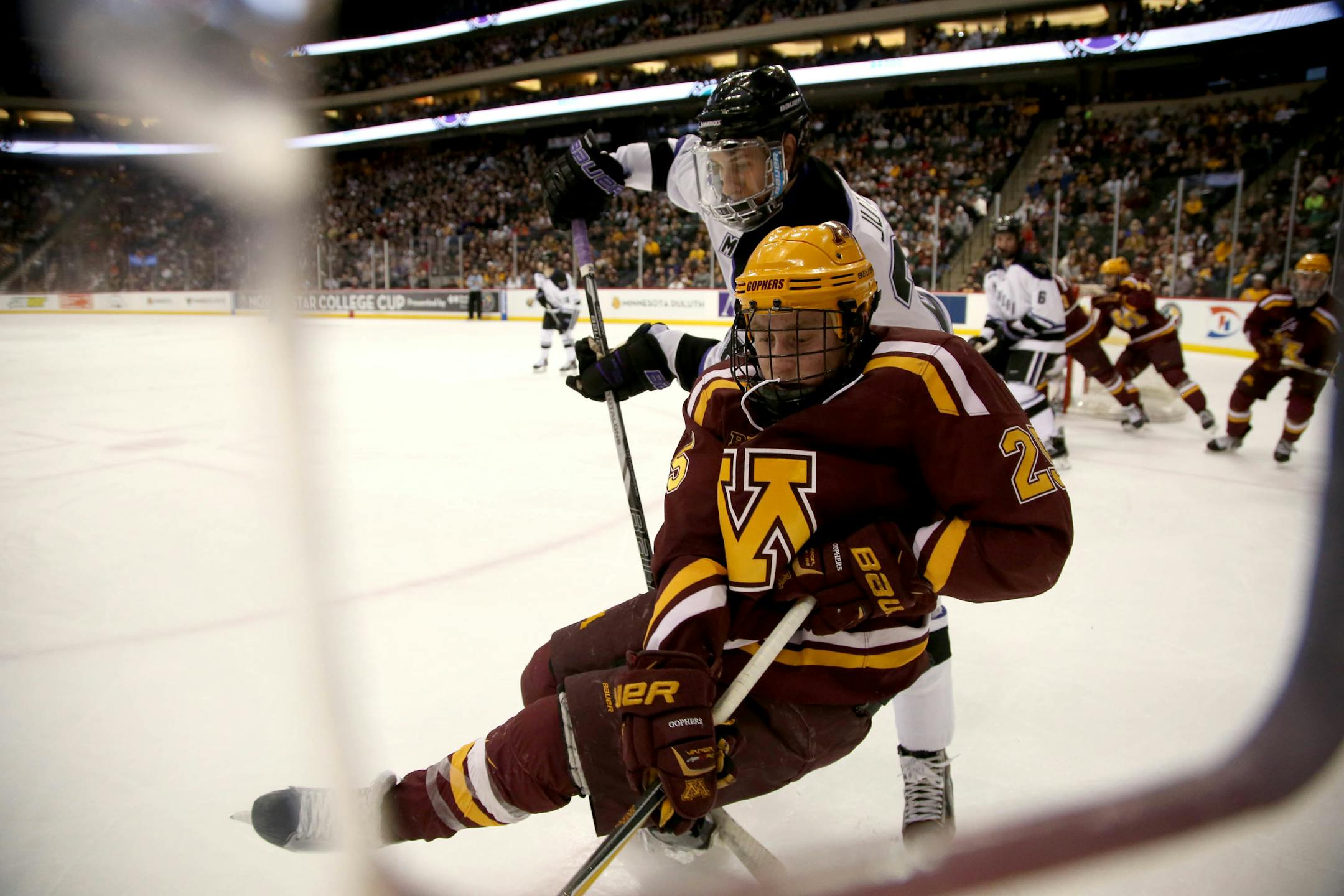 Minnesota State's Jon Jutzi pushed Gopher Justin Kloos off of his feet as they fought for the puck along the boards during the second period. ] (KYNDELL HARKNESS/STAR TRIBUNE) kyndell.harkness@startribune.com Gophers vs Minnesota State at the Xcel Energy Center in St. Paul Min., Friday, January 23, 2015.