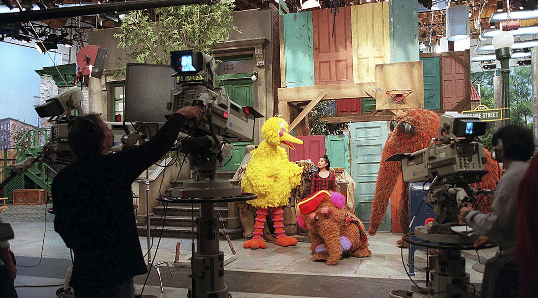FILE -- The characters Big Bird, Mr. Snuffleupagus and Baby Snuffleupagus with Annette Calud during the filming of an episode of PBS's "Sesame Street" at Kaufman Studios in New York in 1995. Sesame Workshop, the nonprofit group behind the childrenís television program, has struck a deal with HBO, the premium cable network, that will bring the next five seasons of ìSesame Streetî to HBO and its streaming outlets starting in the fall of 2015. (Sara Krulwich/The New York Times)