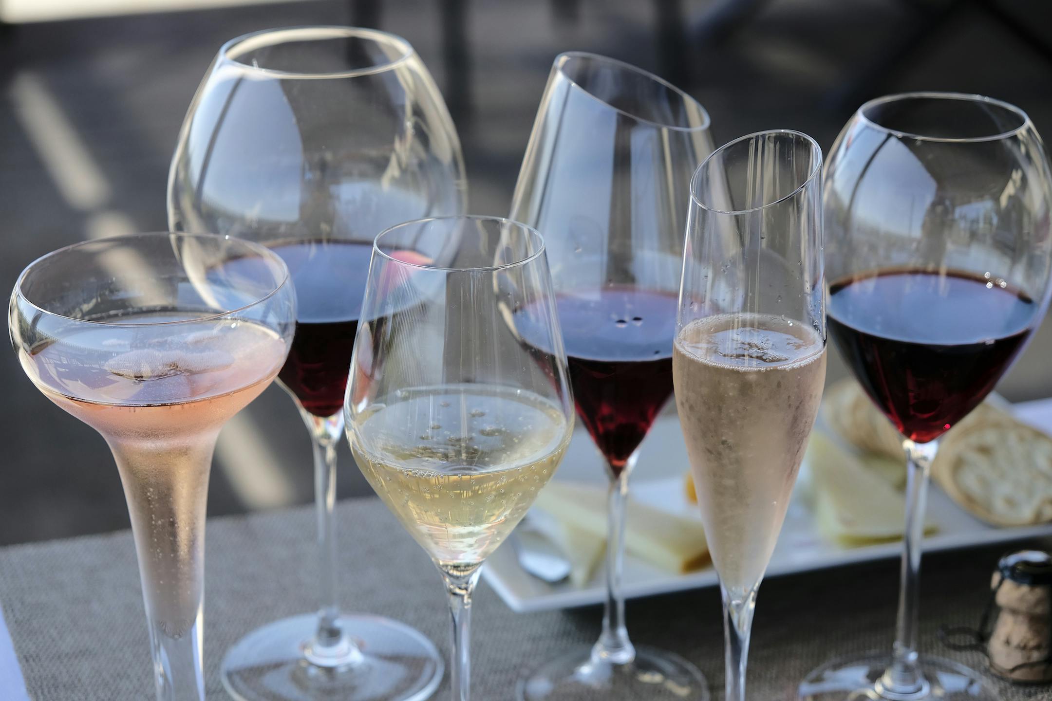 FILE - This Monday, July 10, 2017 file photo shows different shaped glasses of wine in Sonoma, Calif. According to a large genetic study released on Thursday, April 4, 2019, drinking alcohol raises the risk of high blood pressure and stroke, debunking previous claims that moderate drinking was protective. (AP Photo/Eric Risberg)