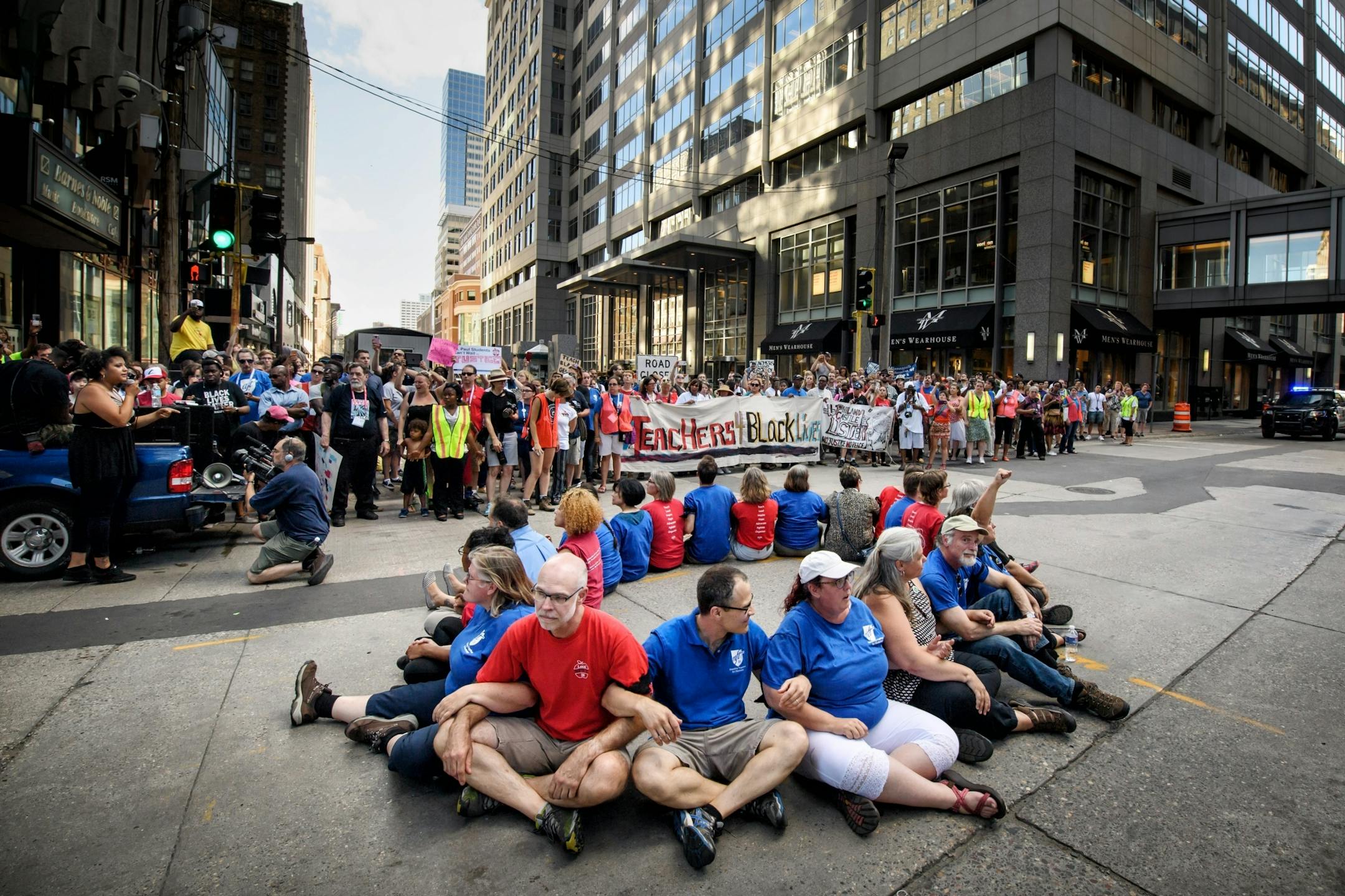 The protesters stopped in front of US Bancorp Center to protest the bank's policies. Twenty one were arrested.