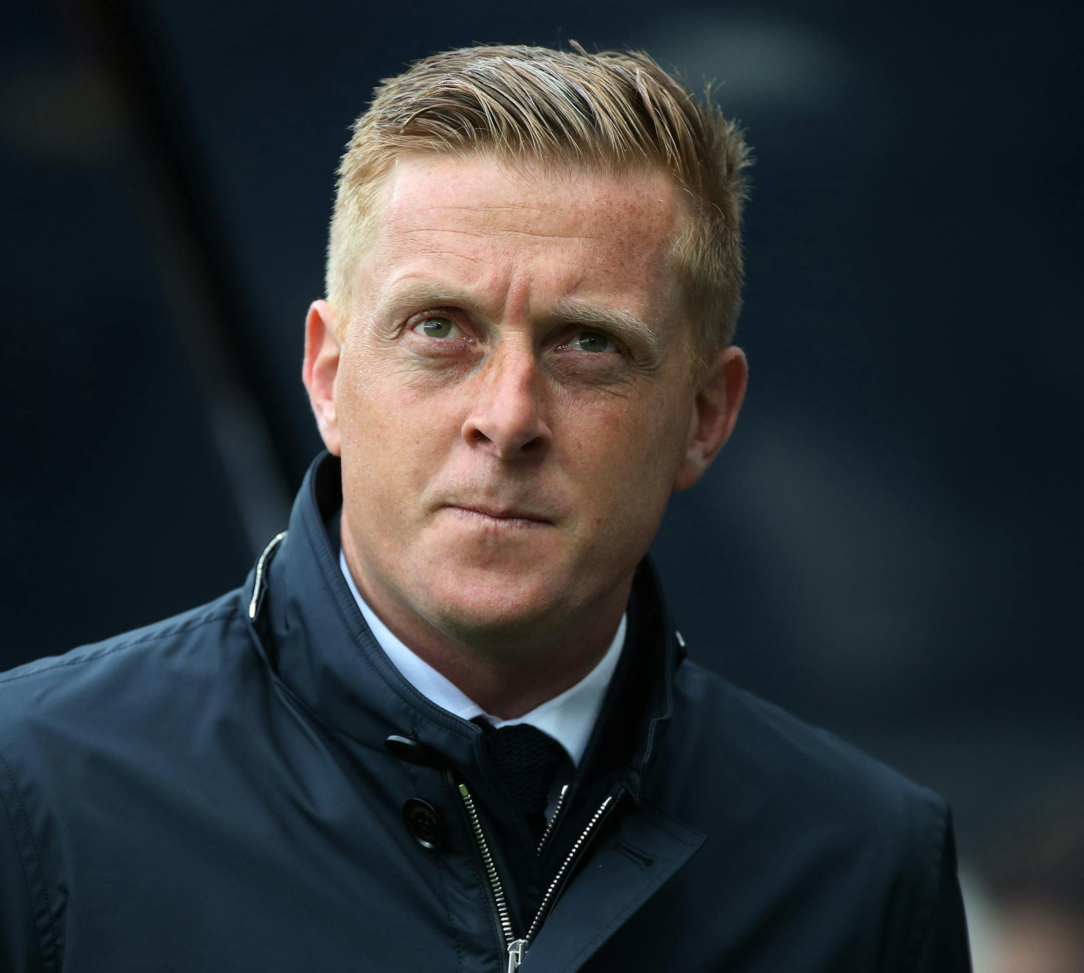FILE - This is a Saturday, April 25, 2015 file photo of Swansea City's manager Garry Monk as he awaits for the start of their English Premier League soccer match between Newcastle United and Swansea City at St James' Park, Newcastle, England. Swansea fired manager Garry Monk Wednesday Dec. 9, 2015, after nearly two years in charge, following a dip in form that has seen the team win just one of its last 11 Premier League games. (AP Photo/Scott Heppell, File)