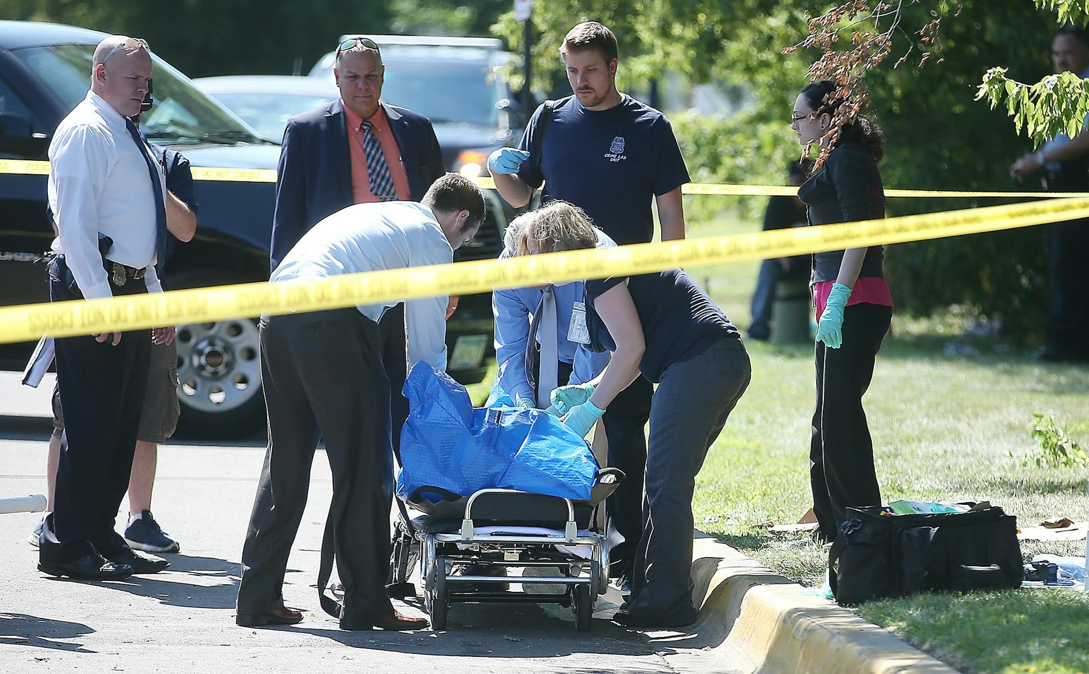 Minneapolis police and the Hennepin County Medical Examiner worked the scene where a body was discovered, Wednesday, August 12, 2015 in Minneapolis, MN.