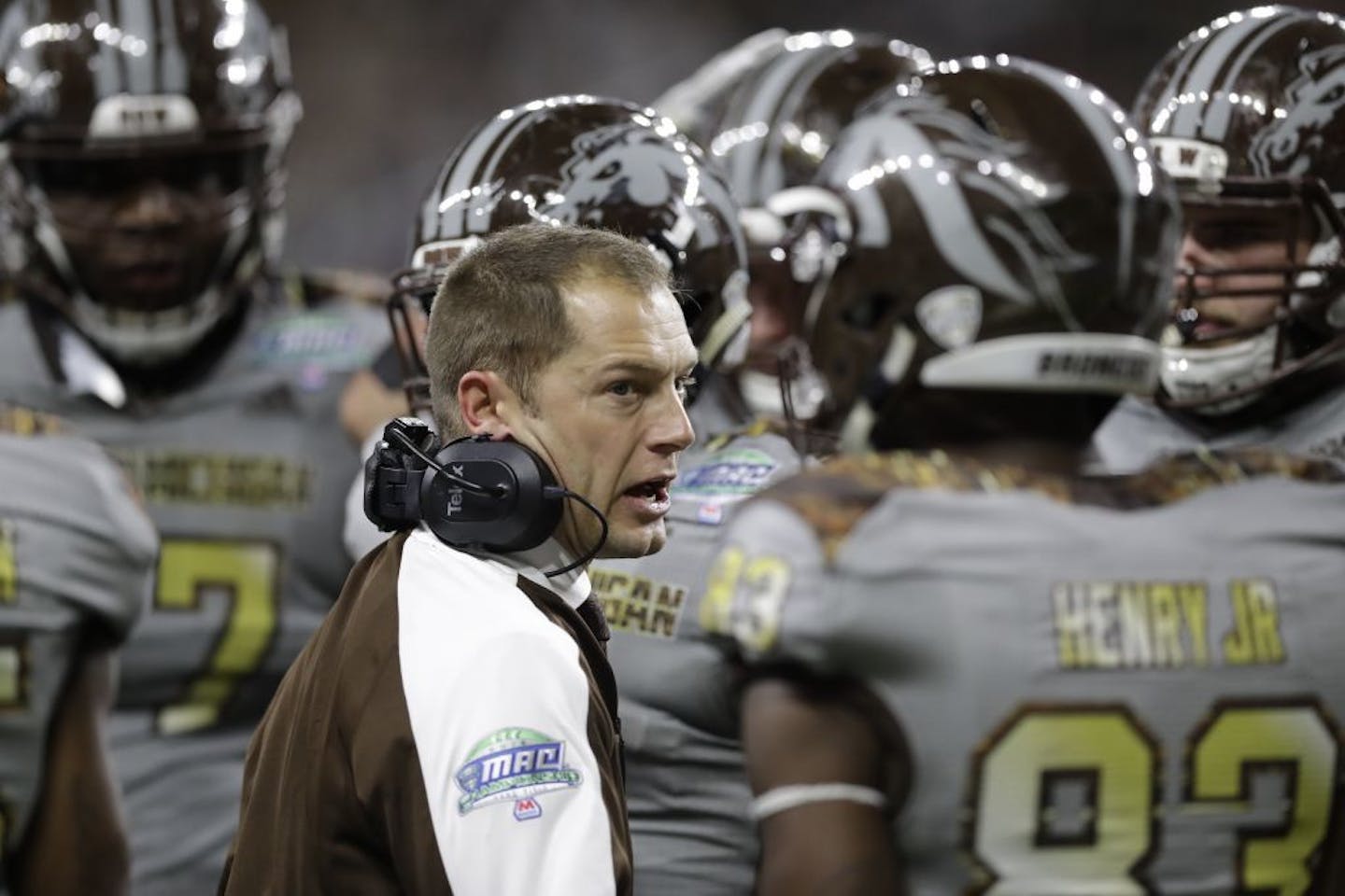 Western Michigan head coach P.J. Fleck talks to his team during the second half of the Mid-American Conference championship NCAA college football game against Ohio, Friday, Dec. 2, 2016, in Detroit.