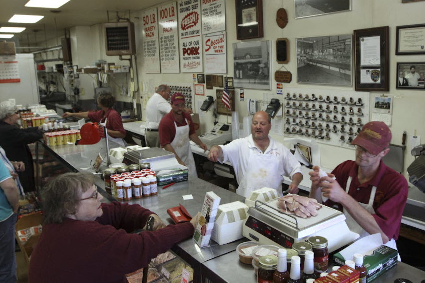 BRUCE BISPING &#x2022; bbisping@startribune.com Robbinsdale, MN., Saturday, 9/11/10] Customers lined the counter at Hackenmueller Meats, an old fashion meat shop on West Broadway in the revitalized downtown Robbinsdale.