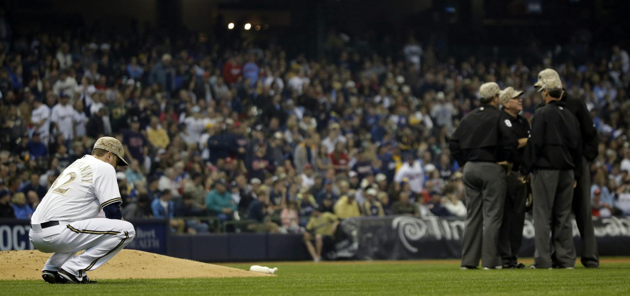 Brewers relief pitcher Tom Gorzelanny reacted as umpires discussed a home run hit by the Twins' Joe Mauer during the seventh inning Monday.