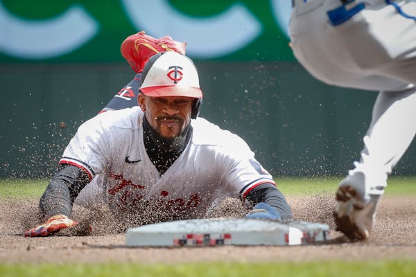 Minnesota Twins’ Byron Buxton slid into third base advancing on a wild pitch last month against Kansas City. Buxton may not be playing in the field,