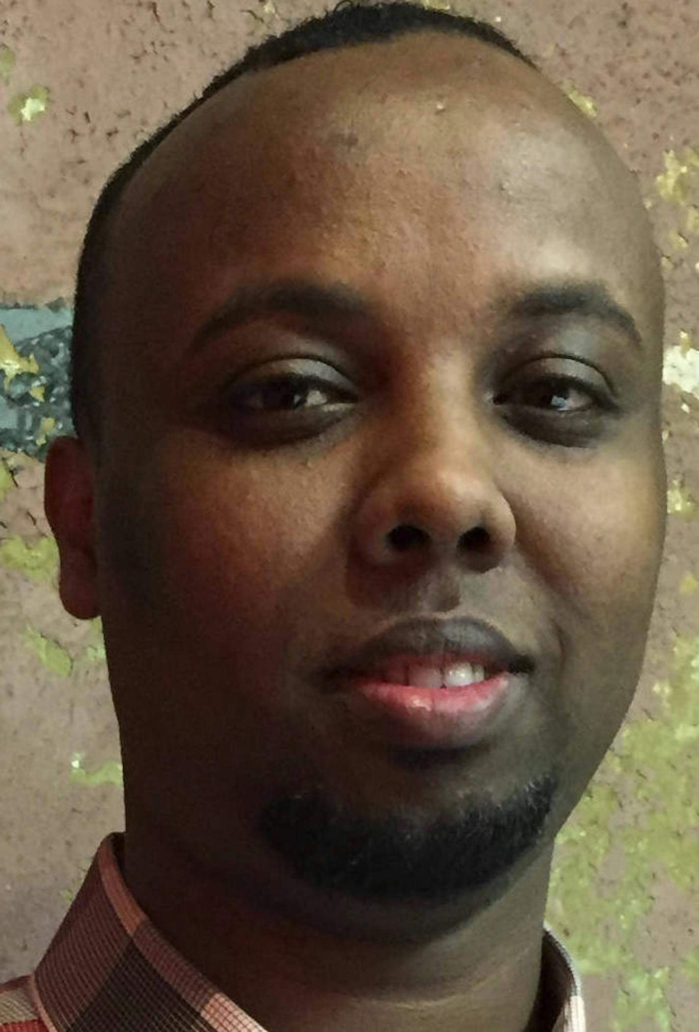 In this Feb. 14, 2017 photo, Mohamed Farah poses at his office in Minneapolis. Farah is executive director of Ka Joog, a group that works to engage Somali youth in Minnesota. The group rejected $500,000 in federal funding earlier this month, saying the actions and statements of President Donald Trump are anti-Muslim and anti-immigrant. (AP Photo/Amy Forliti)