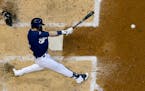 Milwaukee Brewers' Christian Yelich hits a single during the fourth inning of a baseball game against the Atlanta Braves Monday, July 15, 2019, in Mil