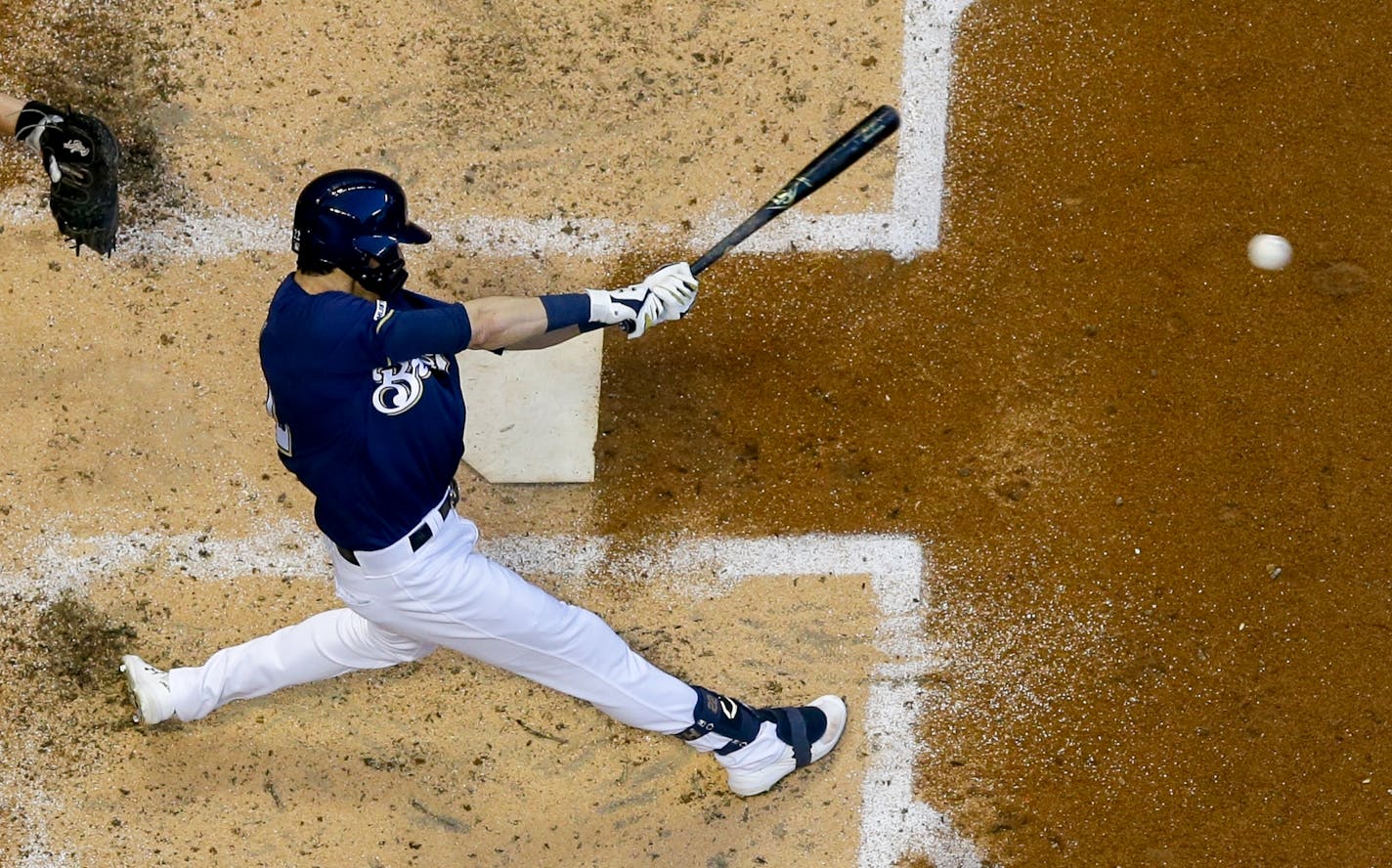 Milwaukee Brewers' Christian Yelich hits a single during the fourth inning of a baseball game against the Atlanta Braves Monday, July 15, 2019, in Milwaukee. (AP Photo/Morry Gash)