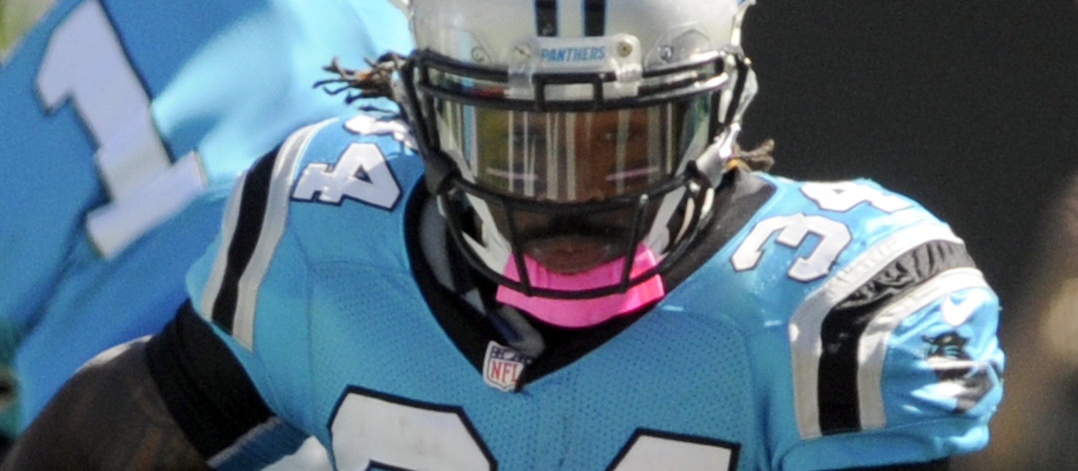 Carolina Panthers' DeAngelo Williams (34) runs against the St. Louis Rams in the first half of an NFL football game in Charlotte, N.C., Sunday, Oct. 20, 2013. (AP Photo/Mike McCarn)